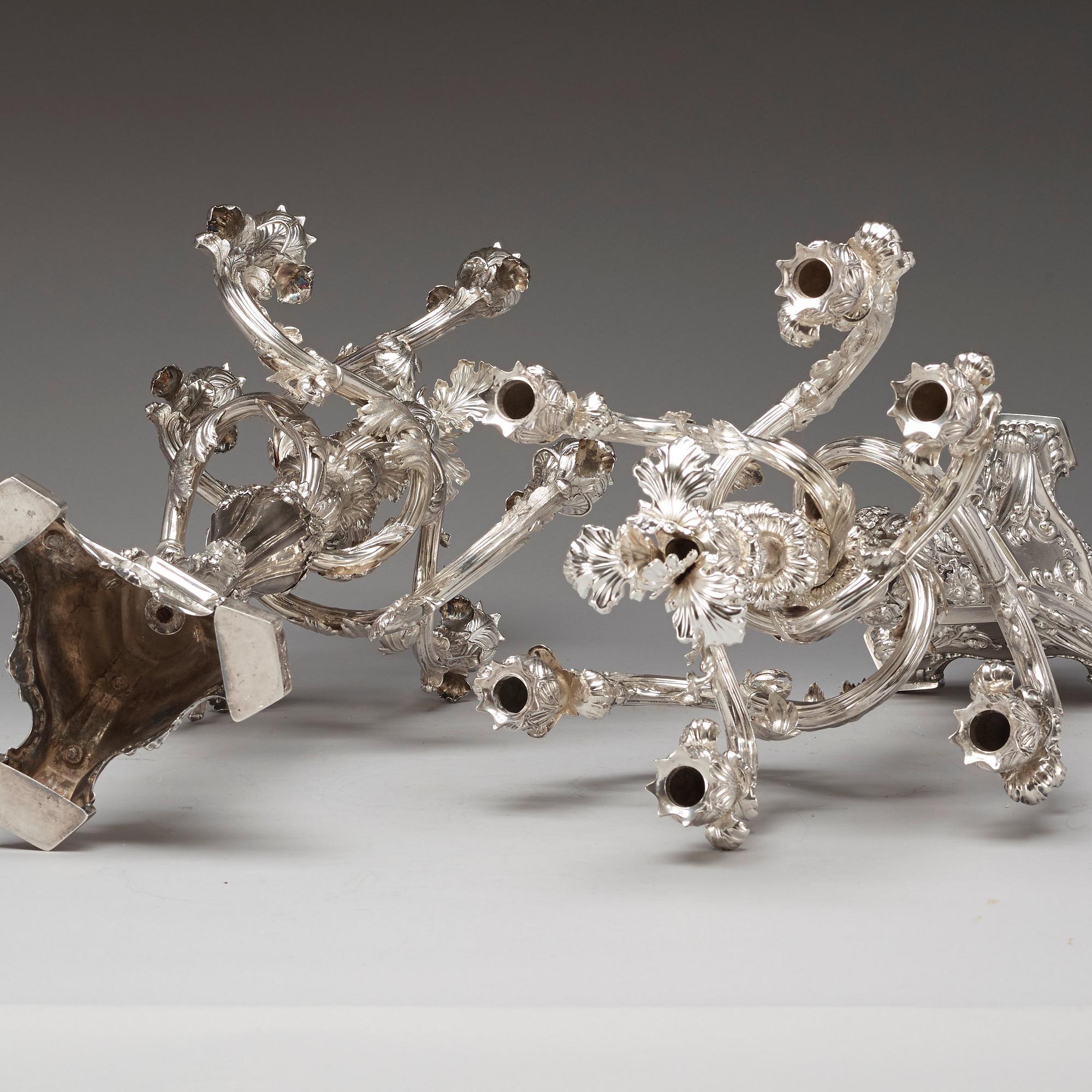 A pair of Swedish 19th century silver candelabras, marks of Gustaf Möllenborg, Stockholm 1845 and 1893.