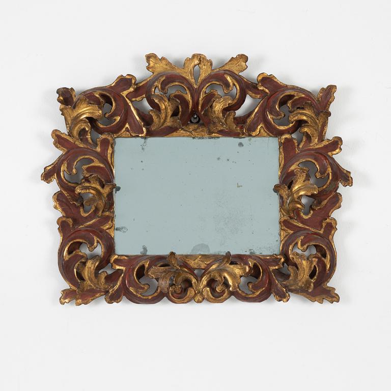 A presumably Italian Giltwood mirror, 18th century.