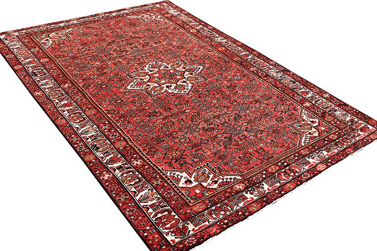 An oriental carpet, c. 325 x 222 cm.