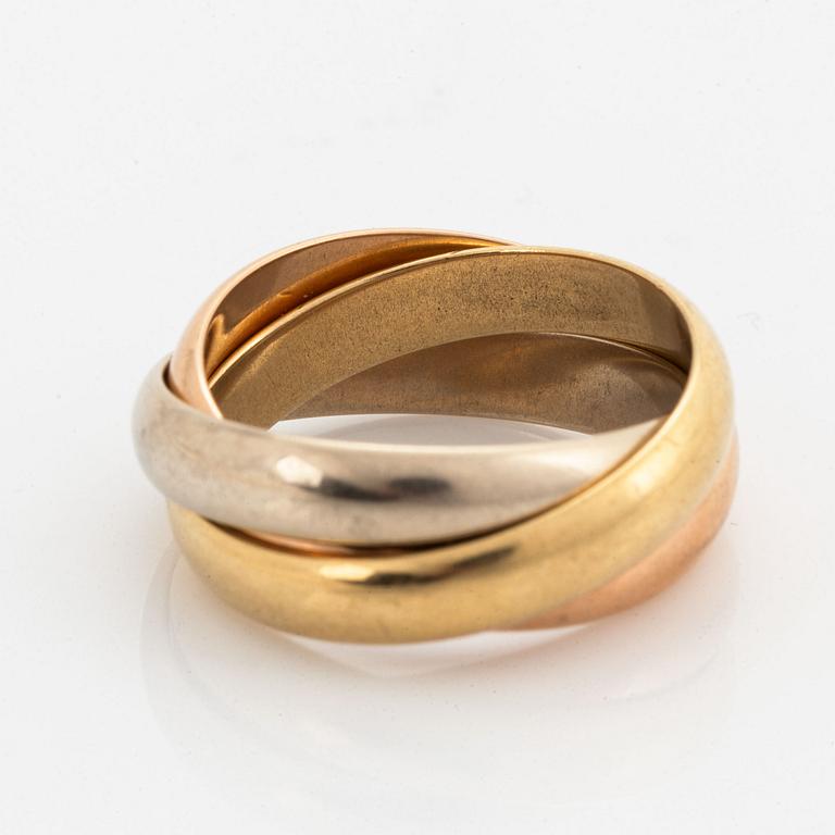 An 18K white, rose and yellow gold ring.