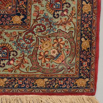 A CARPET, a semi-antique Tabriz, ca 339 x 253,5 cm.