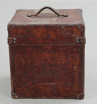 A early 20th cent brown leather trunk by Louis Vuitton.