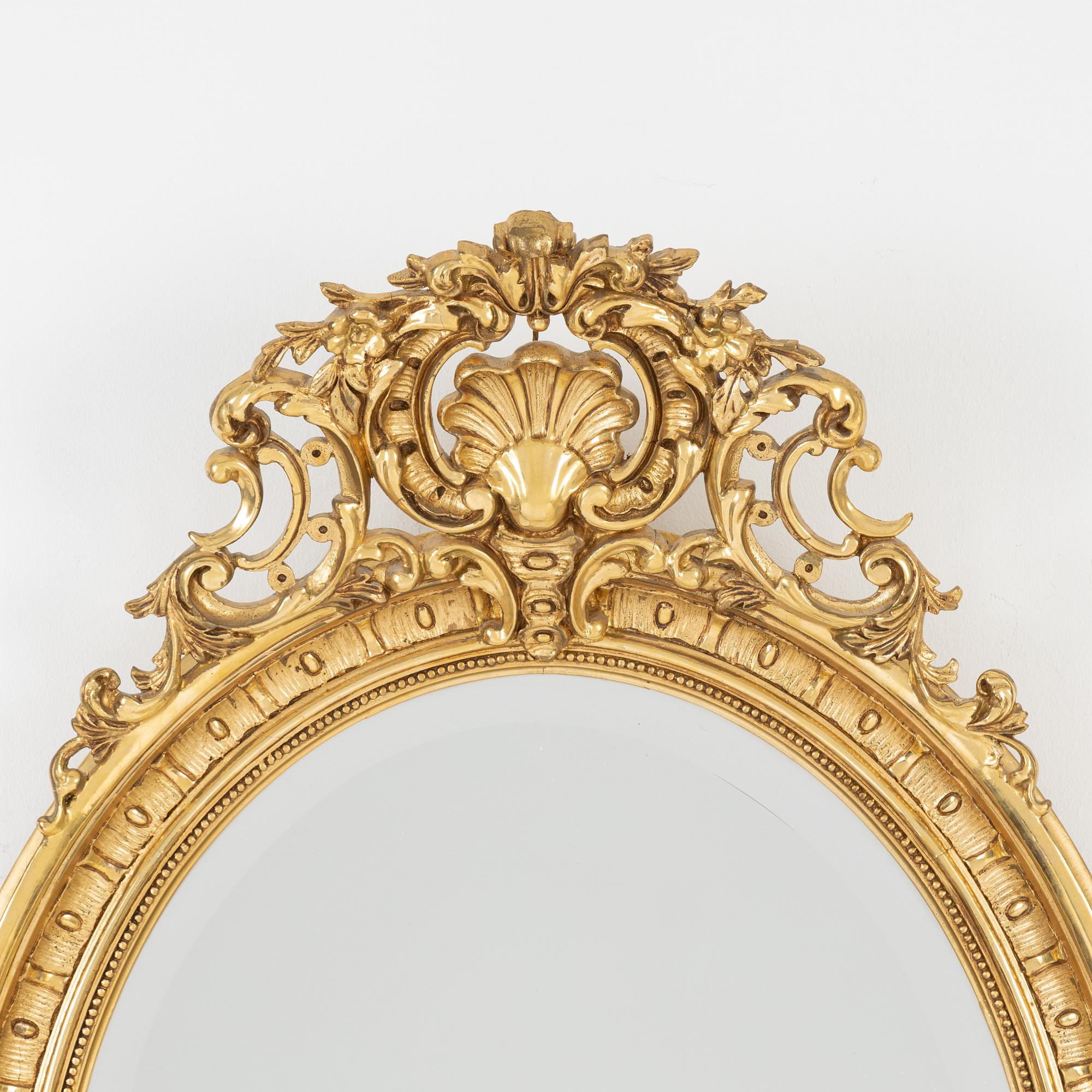 A Rococo style mirror, first half of the 20th Century.