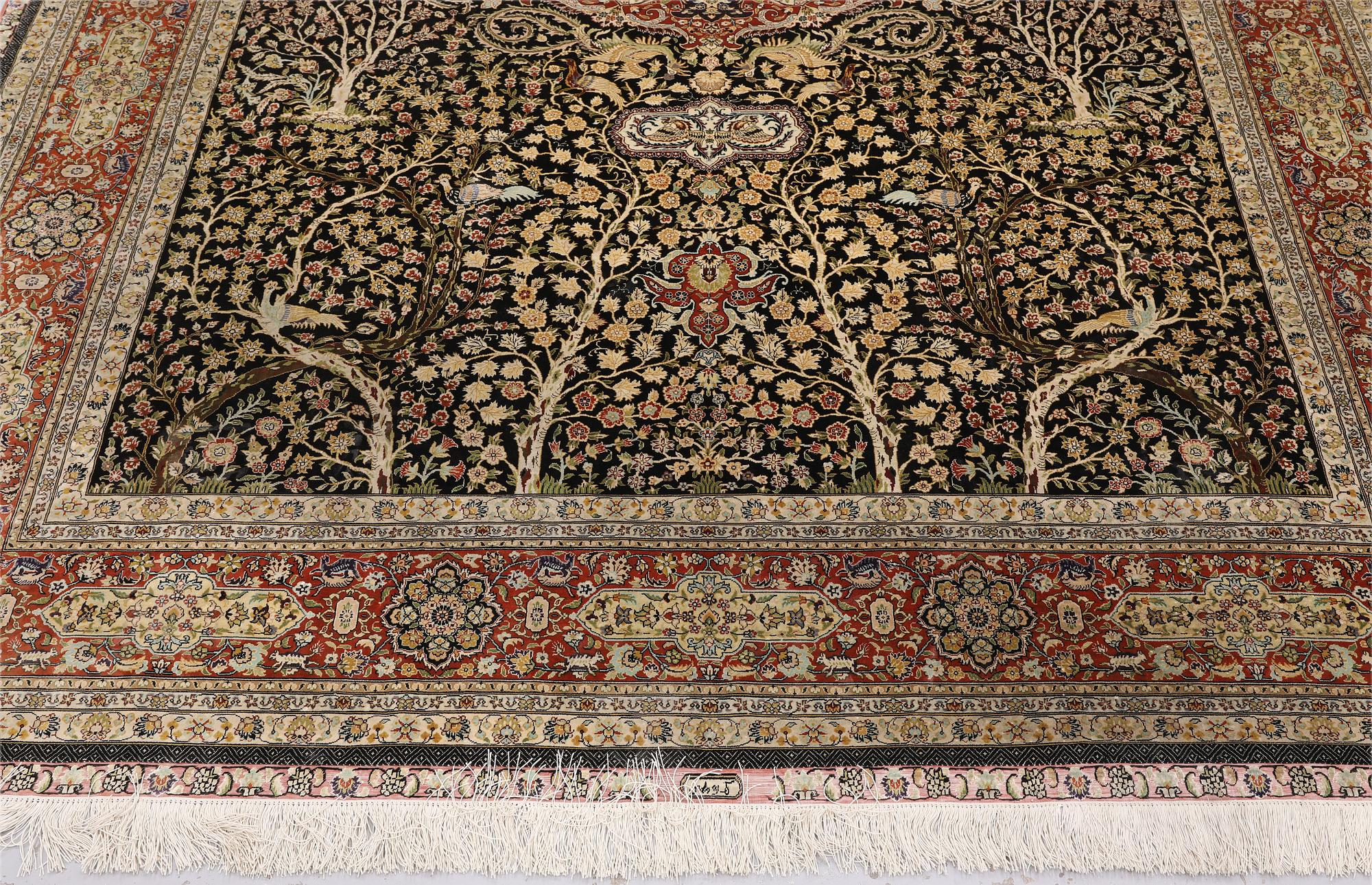 A oriental silk carpet, 303 x 201 cm.