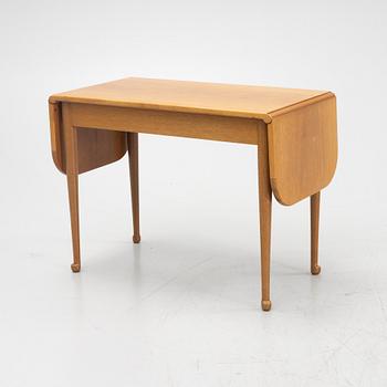 Josef Frank, a model 1007 mahogany drop leaf table, Svenskt Tenn, Sweden, second part of the 20th Century.