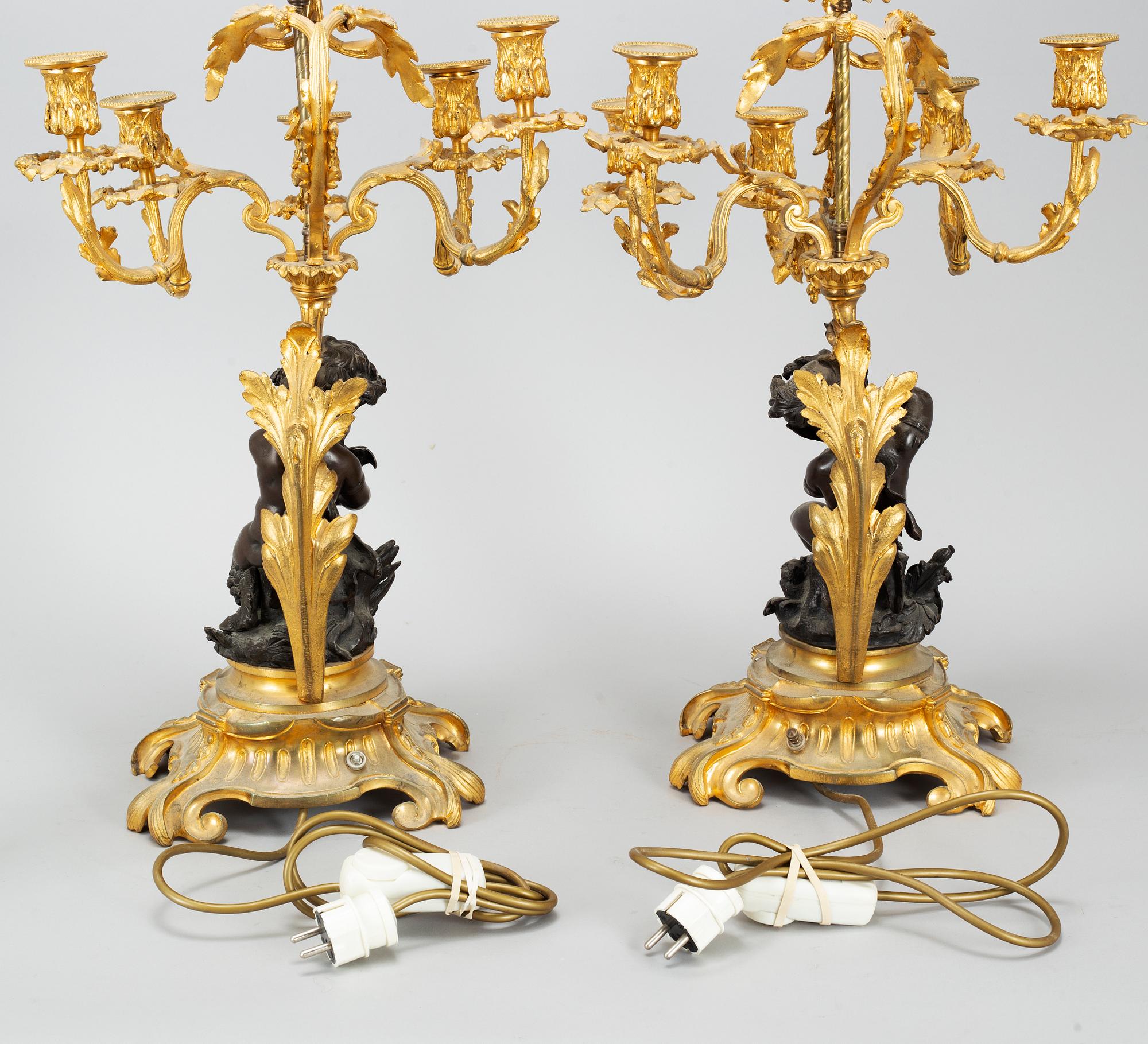 A pair of  mid 19th century, rococo-style TABLE LAMPS/CANDELABRA.