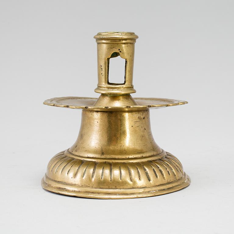 A 16th century bronze candlestick.