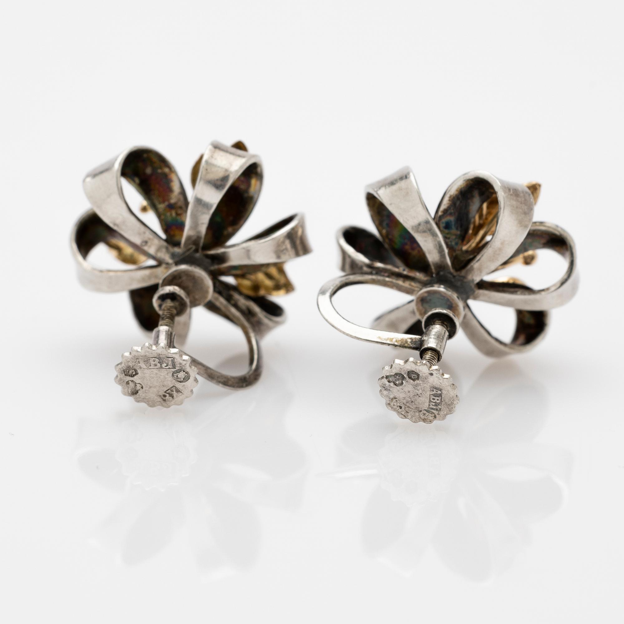 Earrings, a pair, silver and 14k gold with brilliant-cut diamond.