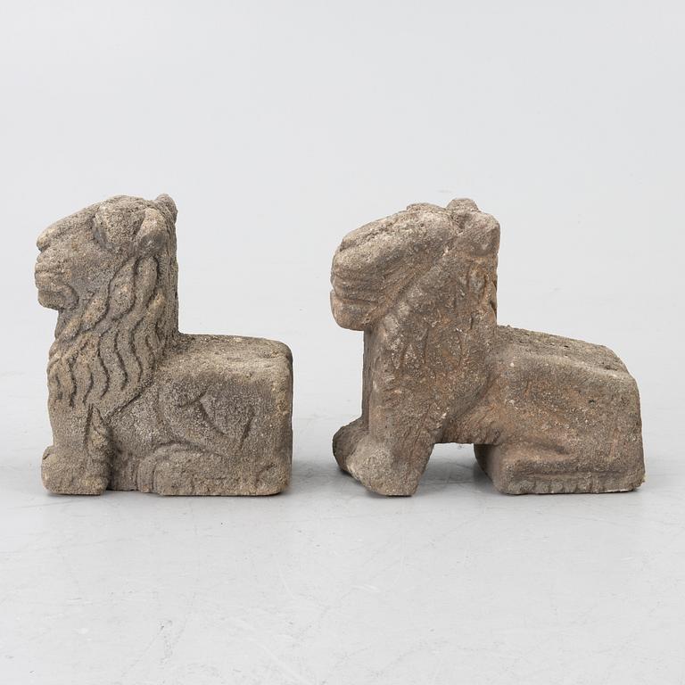 A set of two lion garden sculptures.