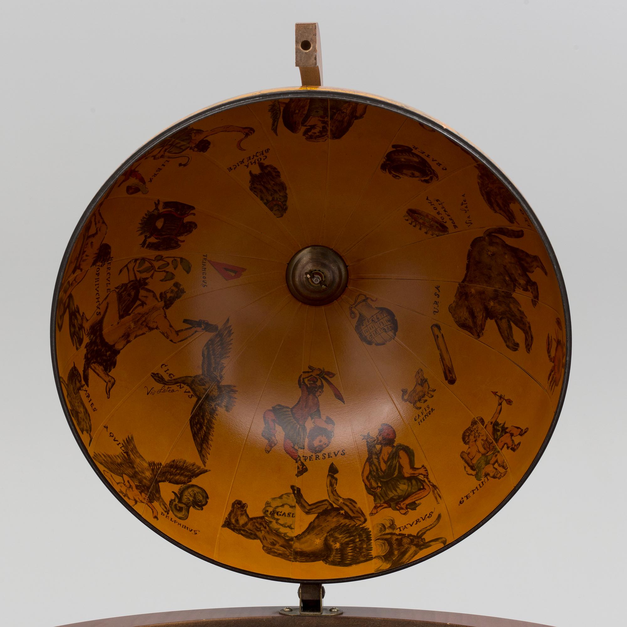 A globe shaped drinks cabinet, circa 2000.