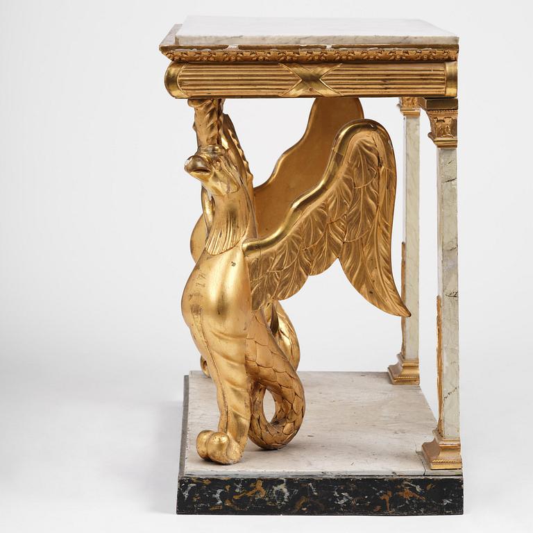 A Swedish Empire gilt wood and white marbel console table.