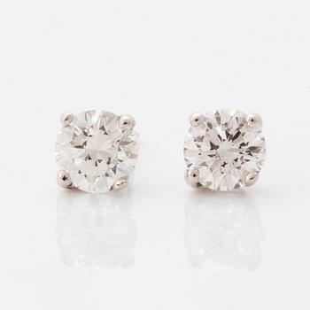 Brilliant-cut diamond stud earrings.