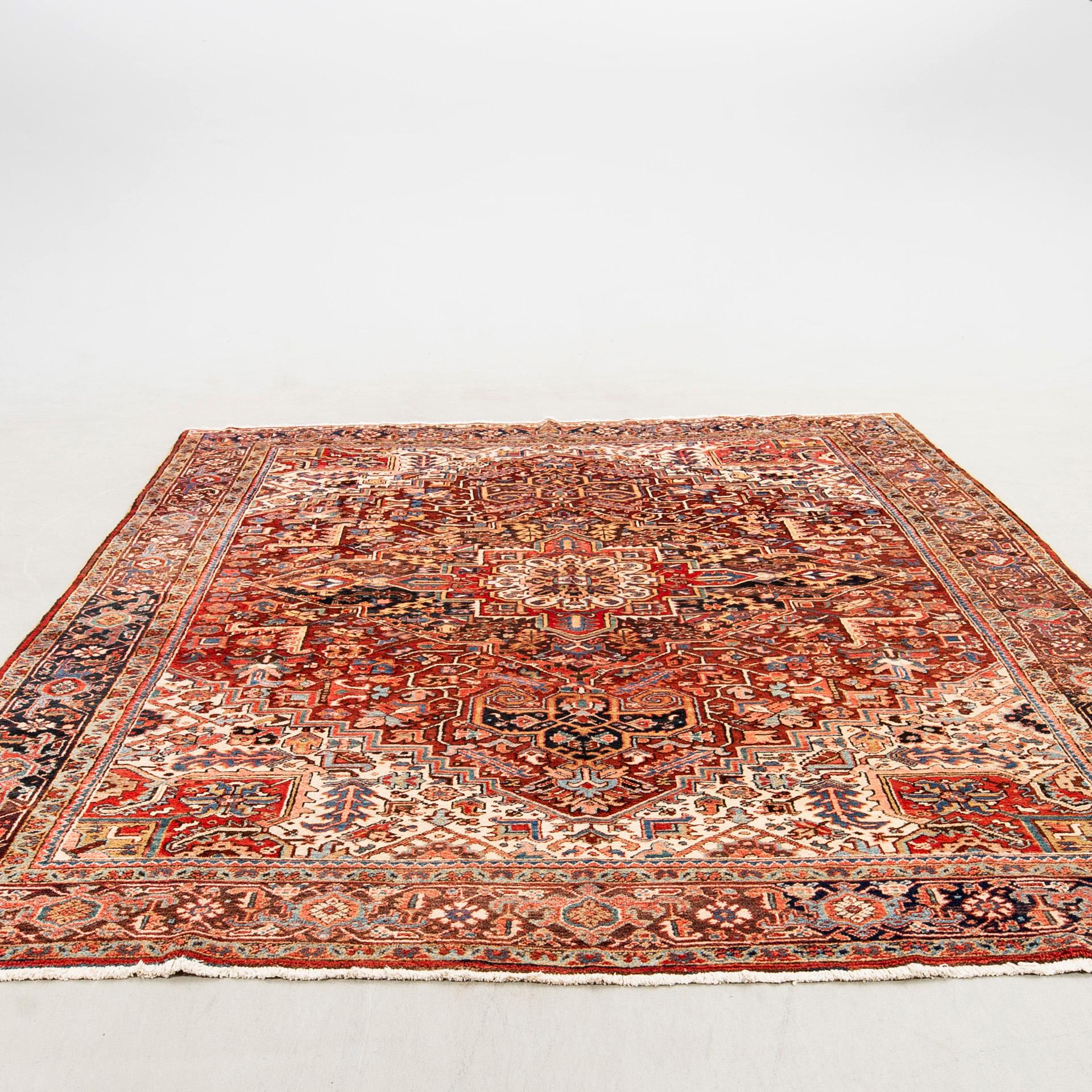A semi-antique Heriz carpet, North west Persia, c. 366 x 282 cm.