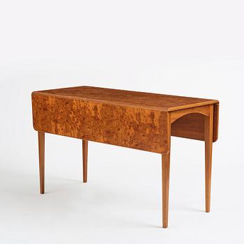 Josef Frank, a mahogany dinner table with burled wood top, Svenskt Tenn Sweden 1940s-50s.