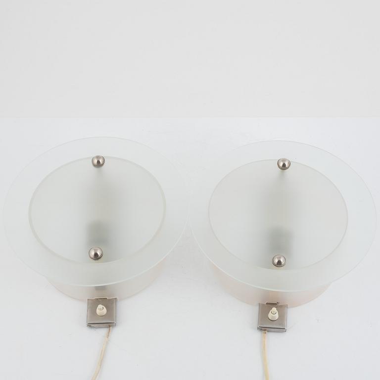 A Pair of 1930s Glass Wall Lamps.
