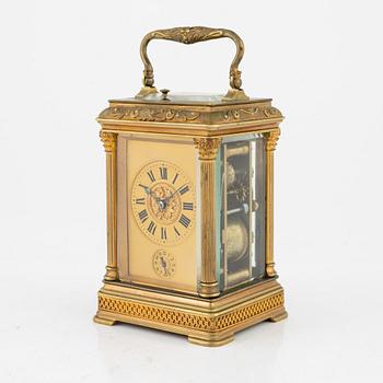 A French Brass and Glass Aiguilles Carriage Clock with Leather Case, first half of the 20th century.