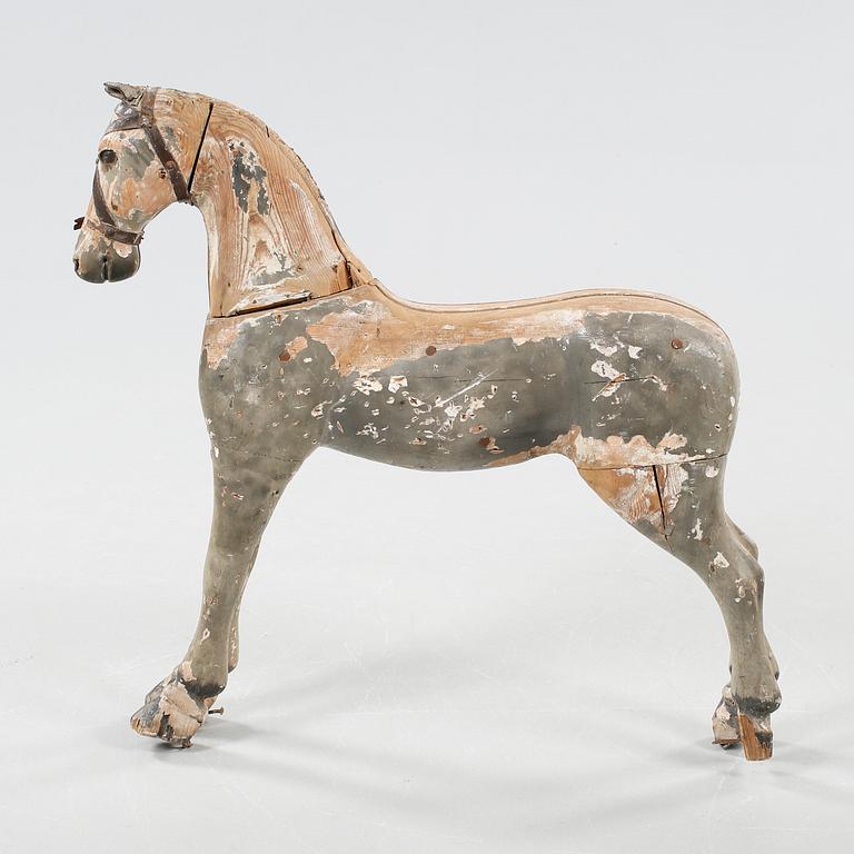 A wodden toy, made like a horse from the first half of the 20th century.