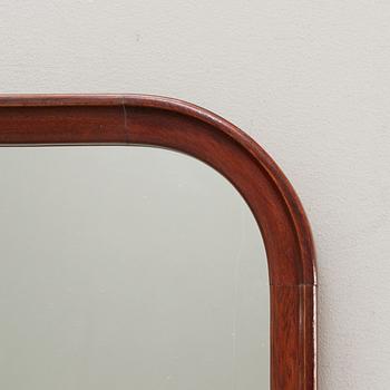 A Swedish mahogany mid 1900s mirror.