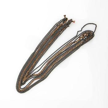 Ole Lynggaard, clasp, 18K gold with a round brilliant-cut diamond, and two necklaces.