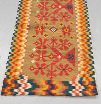 A carriage cushion, double-interlocked tapestry, ca 50 x 99,5 cm, Scania, (Sweden), first half of the 19th century.