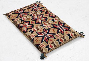 A mid-19th century carrige cushion, flat weave, c. 80 x 46 cm southwest Scania.