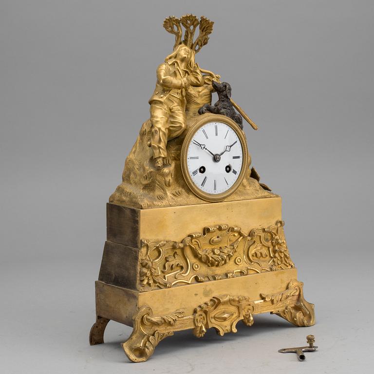 A EMPIRE GILT-BRONZE MANTEL CLOCK.