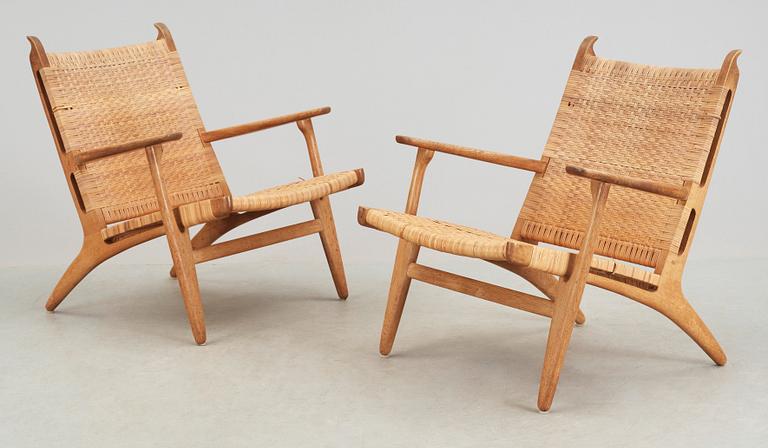 A pair of Hans J Wegner oak and rattan 'CH-27' armchairs, Carl Hansen & Son, Denmark, 1950's-60's.