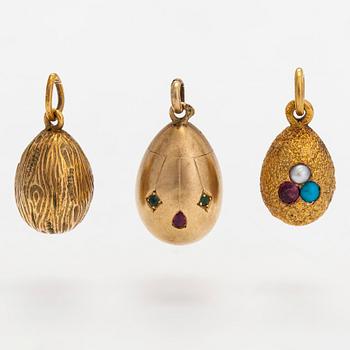 A collection of 24 egg pendants in original wooden box, Russia, early 20th century.