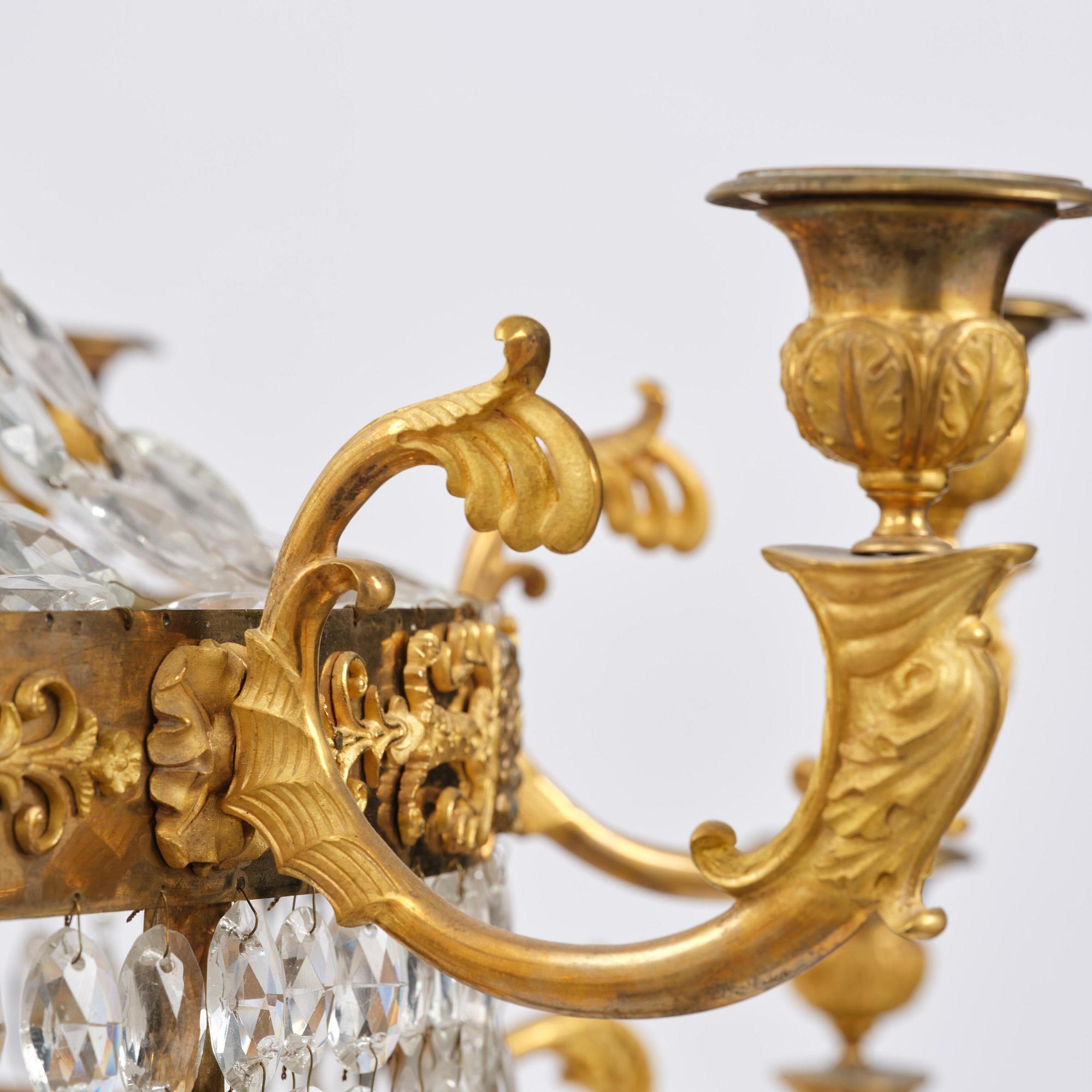 An ormolu and cut glass sixteen-branch Empire chandelier, Paris, early 19th century.