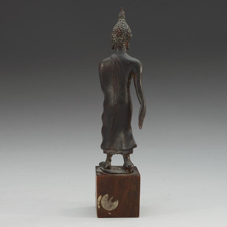 A walking Thai bronze figure of buddha, 19th Century or older.