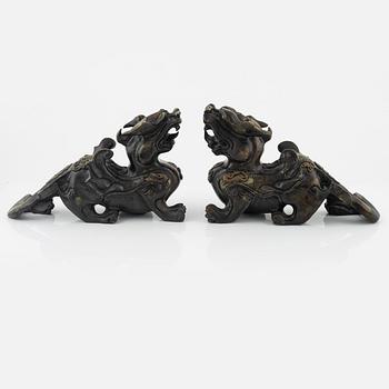 A pair of Chinese stone sculptures of mythical creatures, 20th Century.
