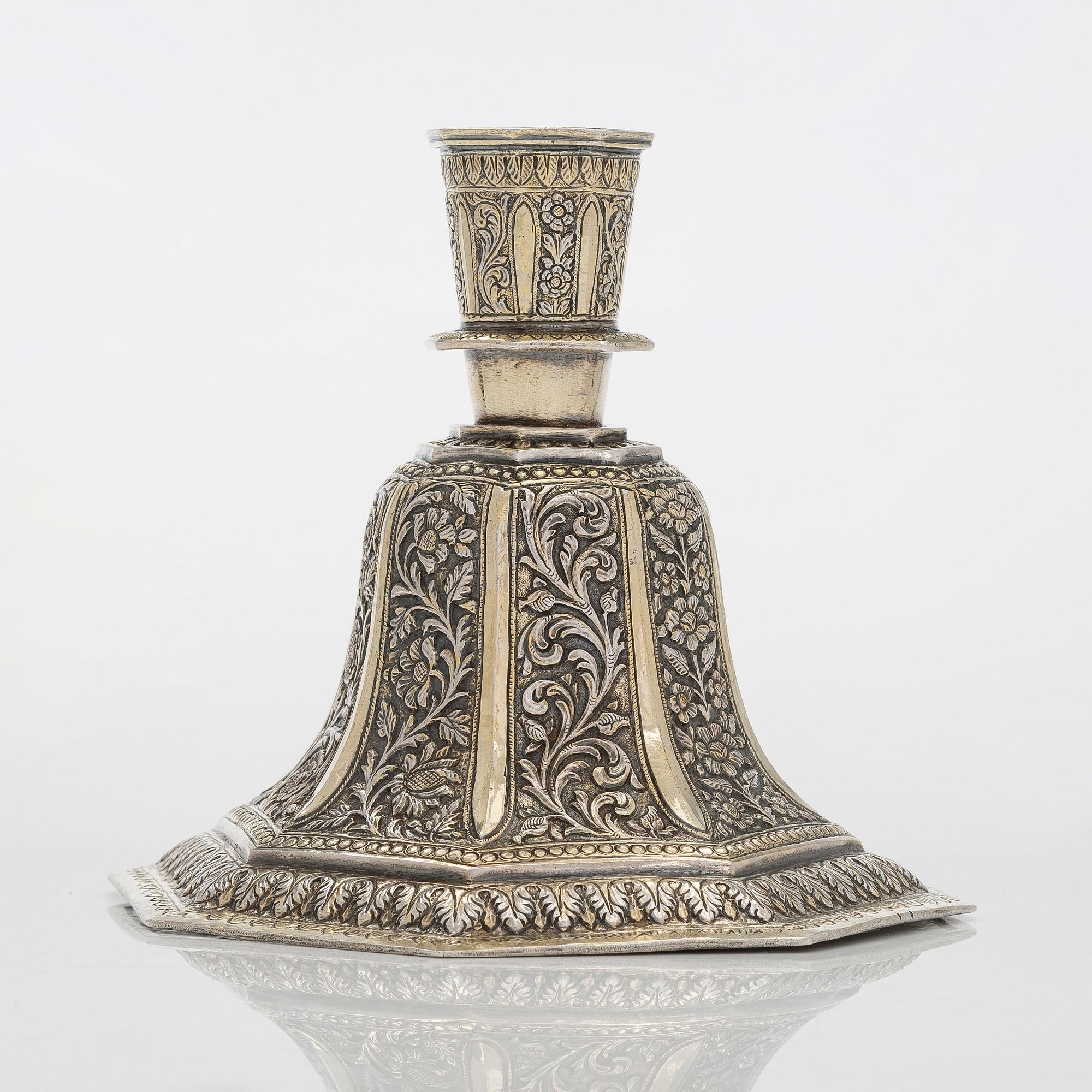 A parcel-gilt silver repoussé water pipe huqqa base, 18th/19th Century.