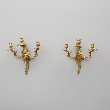 VÄGGLAMPETTER, ett par, mässing, rokokostil, 1800-talets slut.