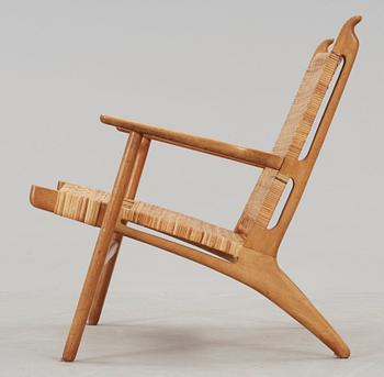 A Hans J Wegner 'CH-27' oak and rattan armchair, Carl Hansen & Son, Denmark 1950's-60's.