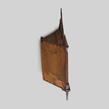 A mid-19th-century wall cabinet.