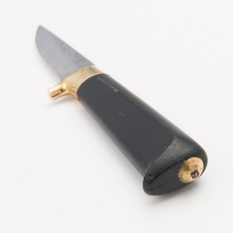 A 1970s Finnish puukko knife in stainless steel, nylon and brass designed by Tapio Wirkkala, Lapin Puukko.