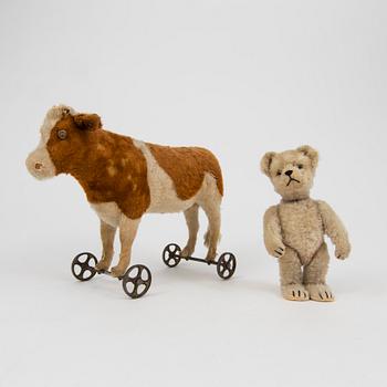 A Steiff cow and a Schuco "Tricky", Germany, 1910 and 1930/40s.