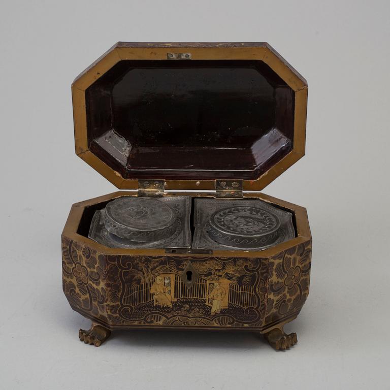 A Chinese Export Lacquerware Tea Caddy with Pewter Fitted Interior, 19th Century.