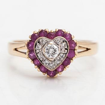 A 14K heart-shaped gold ring, with diamonds approx. 0.15 ct in total and rubies, London 1996.