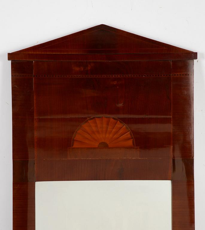 An Empire mirror, first half of the 19th Century.