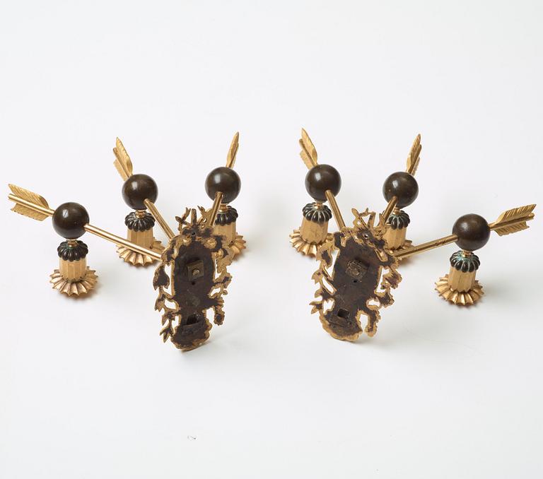 A pair of Empire three-light wall-lights, early 19th century Stockholm or St Petersburg.