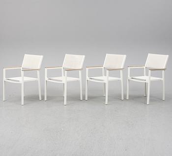 A garden table with four chairs, Gloster.