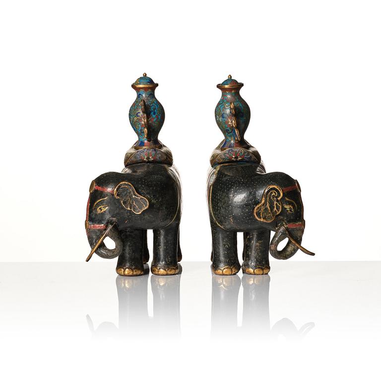 A pair of Chinese cloisonné and chamleve caparisoned elephants, Qing dynasty, 18th/19th Century.