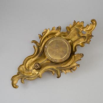 A  rococo-style wall clock around 1900.