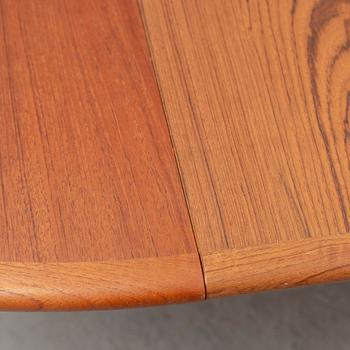 A 1960s teak veneered dining table.