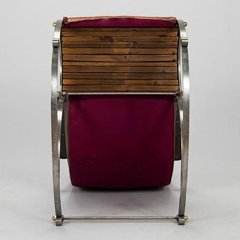 A 20th century steel frame rocking chair.