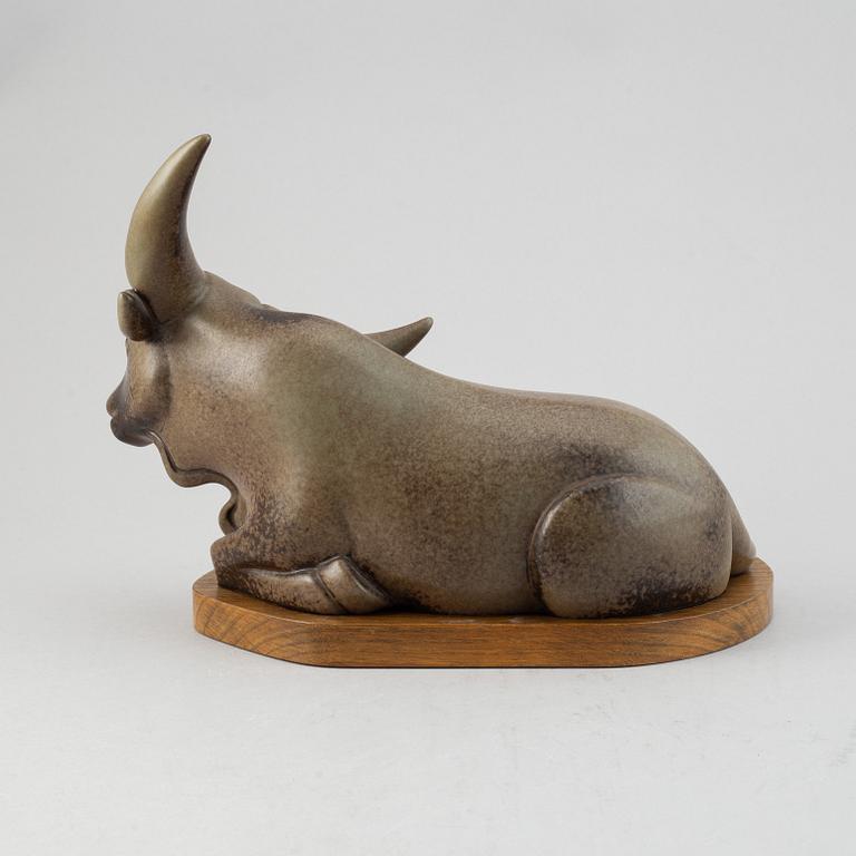 Gunnar Nylund, a stoneware sculpture of a reclining buffalo, Rörstrand, number 16/200.