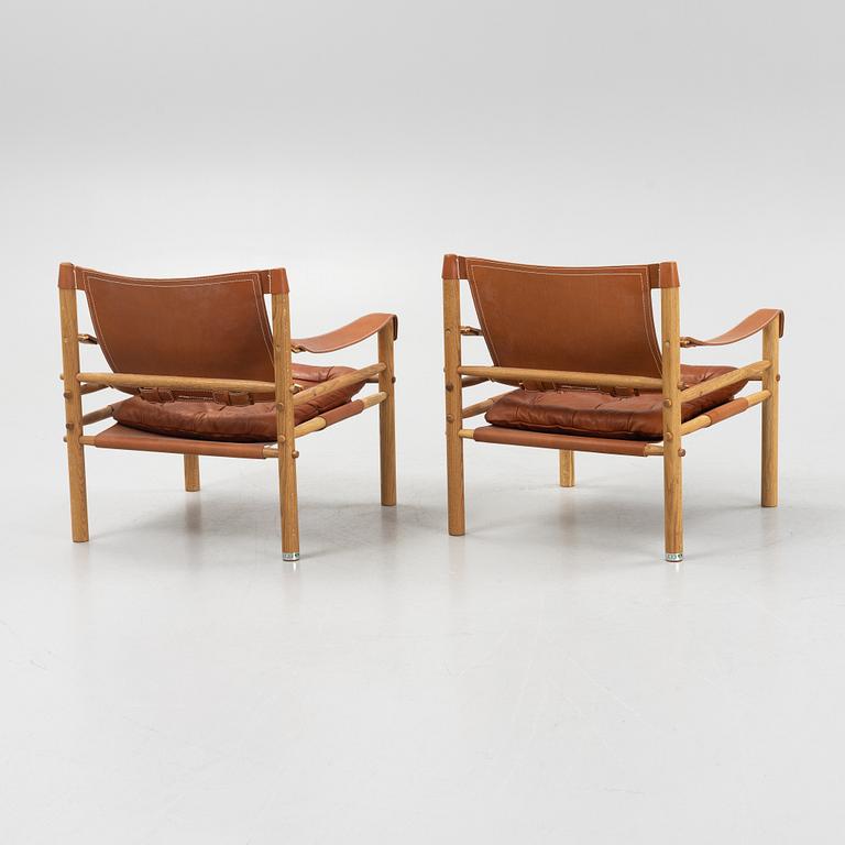 Arne Norell, a pair of 'Sirocco' armchairs with table top, Norell Möbel AB.