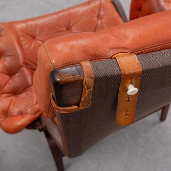 An end of the 20th Century pair of 'Pernilla' easy chairs with leather upholstery by Bruno Mathsson for DUX.