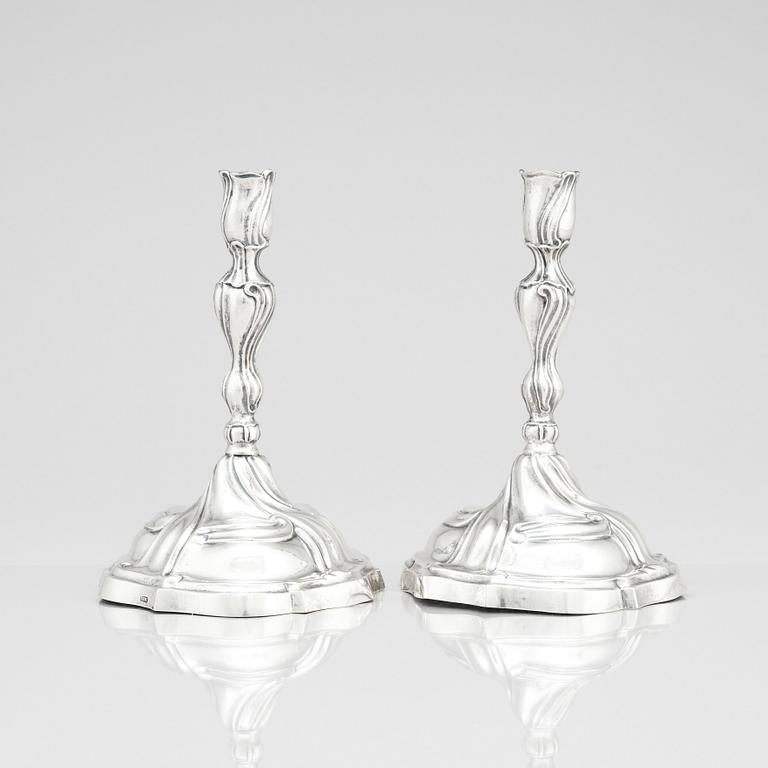 A pair of German silver rococo candle sticks, marks of Johann Balthasar Heckenauer, Augsburg (1775-1777).